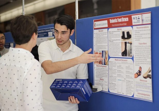 Student presenting at a conference